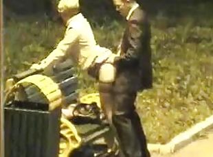 Mature hottie gets fucked from behind in a park at night