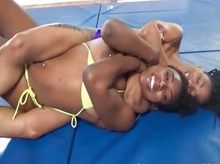 Two horny ebony bimbos enjoy wrestling in the nude