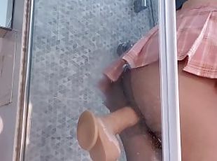 Horny slut Asian whore with big butts fucked by her huge dildo in the bathroom