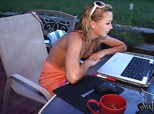 Blonde slut chatting on the computer while her tits are out