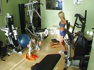 sporty lesbians with fake tits fuck using toys in the gym