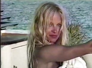 Famous Pamela Anderson having a taste of her boyfriend's penis