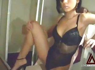 Beauty in black lingerie rubs pussy on camera