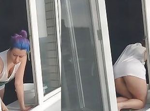 A neighbor girl washes windows without a bra and panties