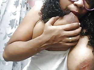 Busty mature Afro Latina sucks both nipples at the same time