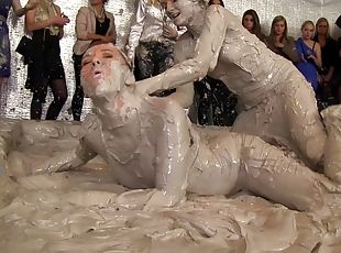 Vivacious blonde with a sexy body having a catfight in a mudbath