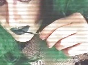 Goth girl with bonus parts applies liquid lip stain