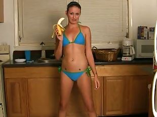 Haily Young enjoys food fetish and fucks pussy with bananas in kitchen