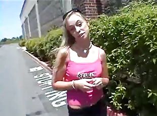 Girl in a parking lot flashing her nipples
