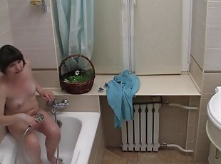 Solo teen masturbates in the shower