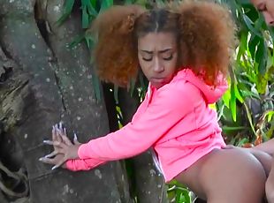 Curly ebony teen fucked in the woods by white hunk