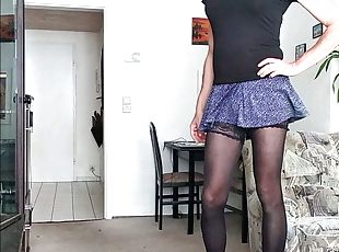 Crossdresser Sissy in Mini-Skirt and high heels