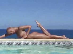Blonde strips from bikini and takes a dip