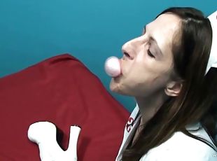 Marie Madison chews gum while wearing a sexy nurse outfit