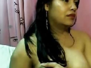 A hot lady showing her boobs while chatting on webcam.