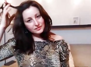 Russian babe in snake skin fucking her pussy.
