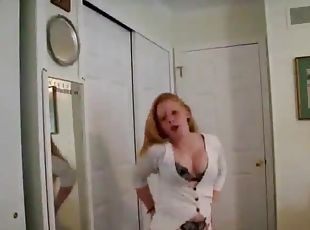 Chubby redhead takes her clothes off and dances funnily