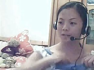 Homemade video of an asian babe teasing through the webcam