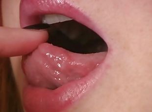 Kinky bitch named Halo shows her lips and tongue for the cam