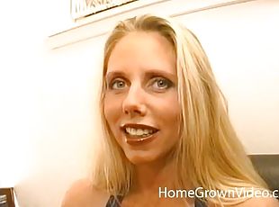 Buxom cougar with long blonde hair playing with a stranger's cock