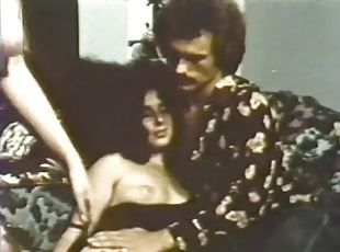 Cock-hungry brunette enjoying a hard one in a vintage porn clip