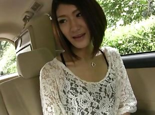 Cute Japanese girl moans while getting toyed in the back of the car