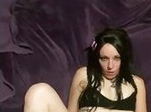 Goth girl using vibrator to cum