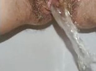 Slow motion pissing girl  Hairy pussy pees Close up