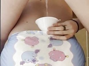 Mistress pees in slaves diaper, uses slave as toilet
